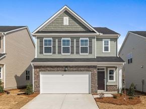 Durham house for rent - A house with a garage door in the front.