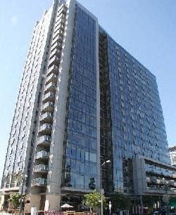 Los Angeles apartment for rent - A tall building with many windows and balconies is shown.