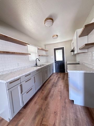Snyder house for rent - A kitchen with white cabinets and a white counter top.