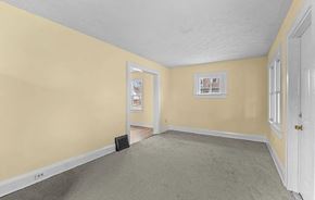Akron house for rent - A room with a white door and a grey carpet.