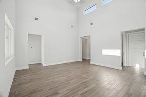Horseshoe Bay house for rent - A spacious room with wooden flooring and white walls.