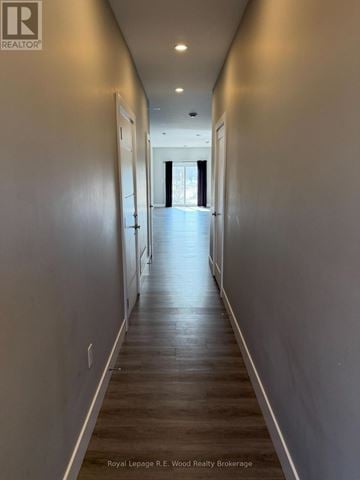 Aylmer townhouse for rent - A modern kitchen with white cabinets and stainless steel appliances.