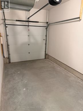 Aylmer townhouse for rent - A kitchen with white cabinets and stainless steel appliances.