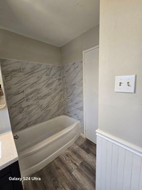 Florissant house for rent - A bathroom with a Galaxy S24 Ultra phone.