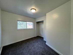 Glassport house for rent - A room with a window and a carpeted floor.