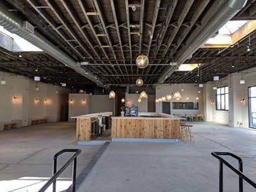 Brooklyn apartment for rent - A large open space with a wooden bar in the center.