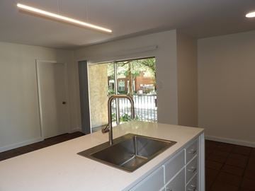 Dallas apartment for rent - A kitchen with a sink and a window.
