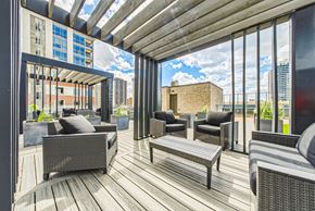 Hamilton apartment for rent - A patio with a wooden floor and furniture.