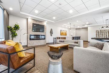 Hamilton apartment for rent - A modern living room with a fireplace and a flat screen TV.