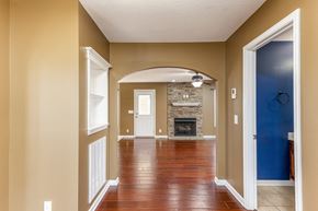 Clarksville house for rent - A room with a fireplace and a blue door.