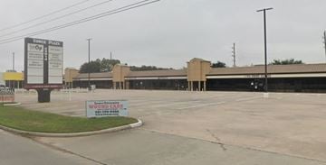 Tomball apartment for rent - A parking lot with a sign for a wound care business.