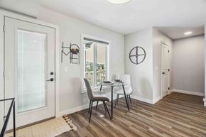 Fort Saskatchewan apartment for rent - A dining room with a table and chairs.