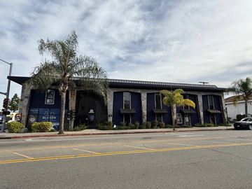 Escondido apartment for rent - A blue building with a sign that says "BLUXEN" on it.