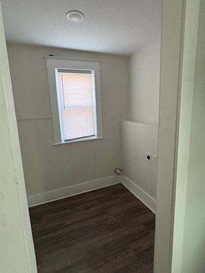 Lima house for rent - A room with a window and wooden flooring.