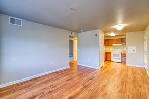 Aurora apartment for rent - A room with wooden floors and white walls.
