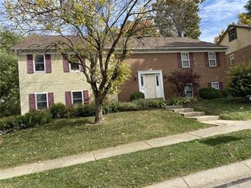 West Carrollton house for rent - A house with a white door and red trim.