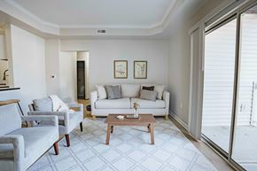 Westerville apartment for rent - A bedroom with a large bed and a window with blinds.