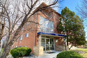 Denver apartment for rent - A brick building with a blue awning and the number 190 on it.