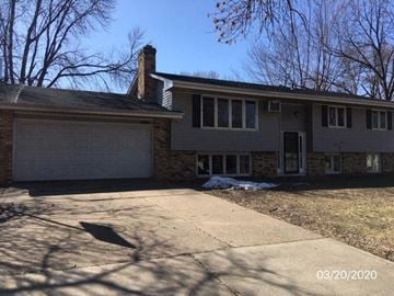 Burnsville house for rent - A house with a garage and a driveway.