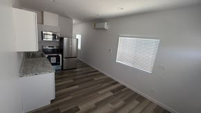 San Diego apartment for rent - A kitchen with a refrigerator, oven, and sink.