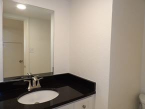 Dallas apartment for rent - A bathroom with a sink and mirror.