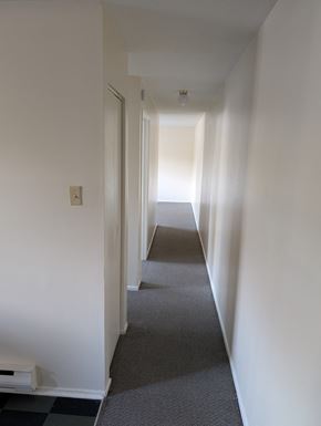 Arnprior apartment for rent - A long hallway with a checkered floor.