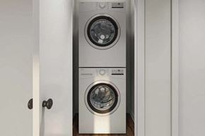 Indianapolis apartment for rent - A washing machine is placed in a cabinet.