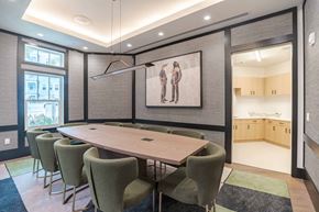 Orlando apartment for rent - A conference room with a long table and chairs.
