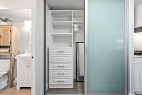 Honolulu apartment for rent - A kitchen with a white cabinet and a white fridge.