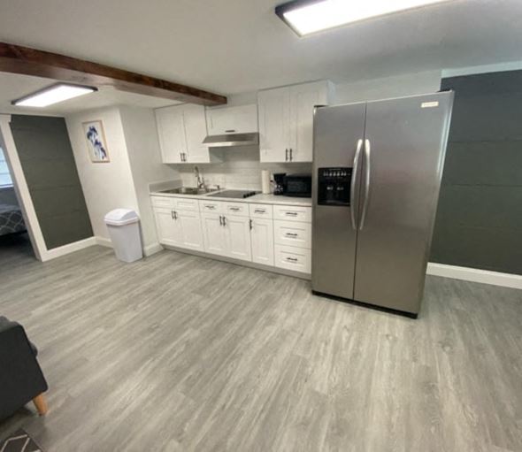 Lakeland apartment for rent - A kitchen with a refrigerator, cabinets, and a countertop.