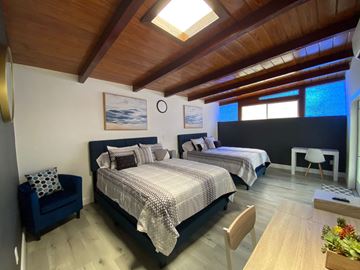Lakeland apartment for rent - A bedroom with two beds and a skylight.