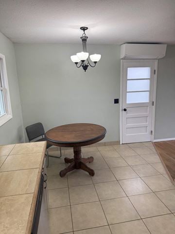 Johnson City house for rent - A dining room with a round wooden table and a chandelier.