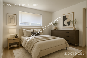 Cleveland apartment for rent - A bedroom with a bed, nightstand, and a painting on the wall.
