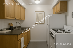 Cleveland apartment for rent - A kitchen with a white stove and wooden cabinets.
