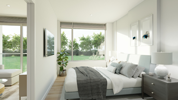 Ottawa apartment for rent - A bedroom with a large bed and a flat screen TV mounted on the wall.