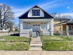 Louisville apartment for rent - A white house with a black roof and a small porch.