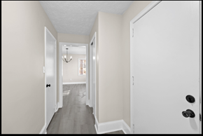 Fayetteville house for rent - A hallway with a white door on the right and a black door on the left.