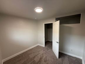 Fort Collins apartment for rent - A room with a carpeted floor and a white door.