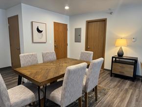 Hawarden apartment for rent - A conference room with a wooden table and chairs.