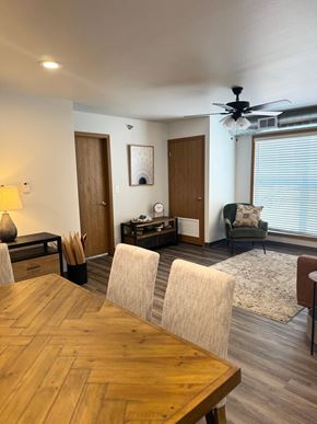 Hawarden apartment for rent - A dining room with a wooden table and chairs.