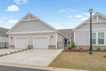Myrtle Beach house for rent - A house with a grey facade and a black lamp post in front.