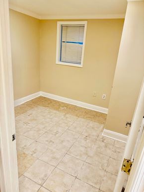 Washington apartment for rent - A room with a tile floor and a window with blinds.