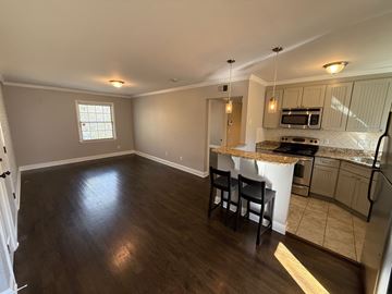 Charlotte house for rent - A kitchen with a countertop and chairs is visible.