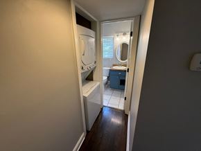 Charlotte house for rent - A small bathroom with a toilet, sink, and mirror.