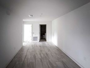 San Antonio apartment for rent - A long hallway with a door at the end.