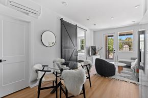 Moorpark apartment for rent - A modern dining room with a glass table and chairs.