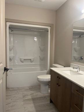 Dartmouth apartment for rent - A bathroom with a toilet, sink, and shower.