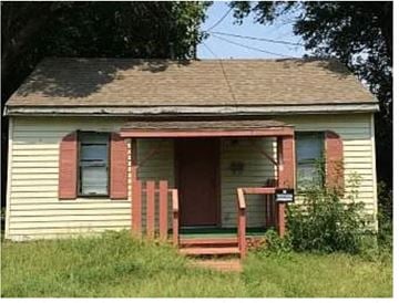 Oklahoma City house for rent - A small house with a red door and a porch.