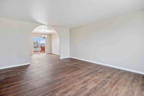 Kimberly house for rent - A room with wooden floors and white walls.