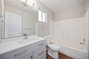 Kimberly house for rent - A white bathroom with a toilet, sink, and bathtub.